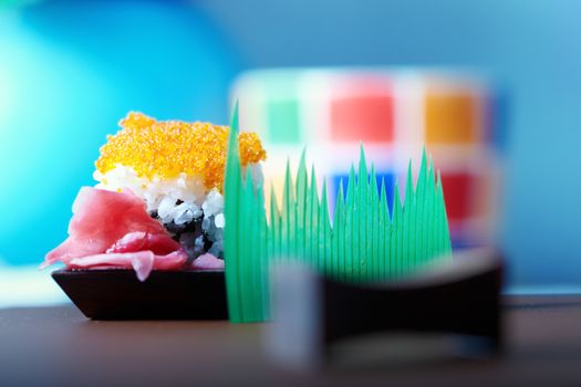 Close-up photo of the sushi with rice and ginger. Natural colors and shallow depth of field