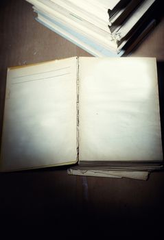 Opened old book with empy pages. Darkness added for mystic effect