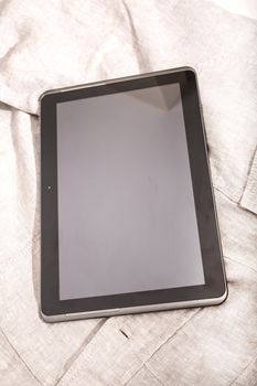 A Tablet PC on some cloth.