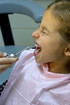 child plays in a dentist. Choosing a profession