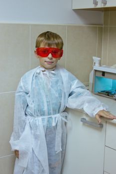 child plays in a dentist. Choosing a profession
