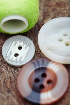 Buttons on a woolen fiber. Extremely macro photo with shallow depth of field
