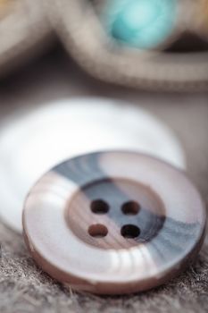 Buttons on a woolen fiber. Extremely macro photo with shallow depth of field