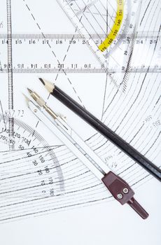 Scheme with compasses rulers and pencil. Close-up photo