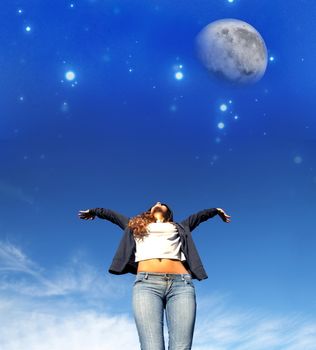 A young woman jumping to the night sky.