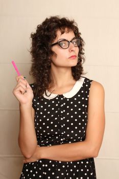 Portrait of a pensive woman in a vintage dress.