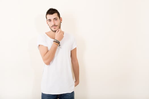 Portrait of a relaxed latin man in casual clothes.