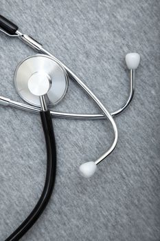 Medical stethoscope on a textured background. Close-up photo