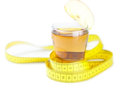 measuring tape,apples and glass of apple juice isolated on white