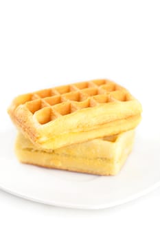 Belgian waffles on a plate isolated on white