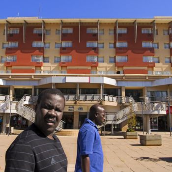 gaborone, botswana, africa � october 2nd, 2013: pedestrians at the main mall shopping and dining area in gaborone.