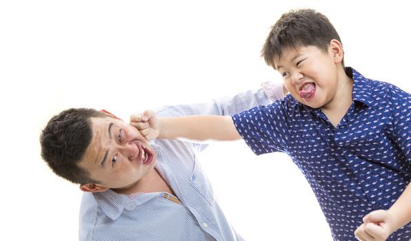 Father and son playing and punching each other on white isolated background