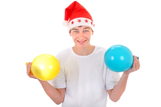 Cheerful Teenager with Two Balloons in Santa's Hat Isolated On The White Background