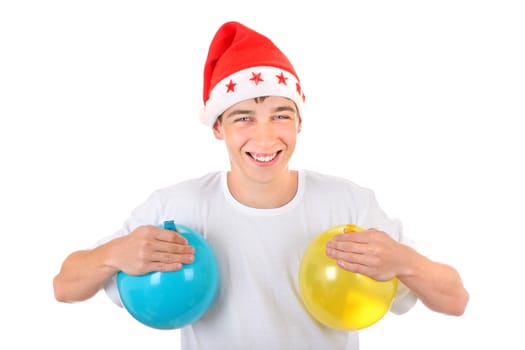 Cheerful Teenager with Two Balloons in Santa's Hat Isolated On The White Background