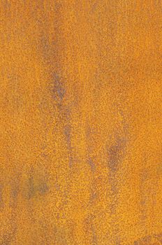 Orange Patterns on the Rusty Surface of the Metal