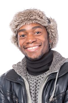 Portrait of a handsome smiling African-American wearing a fur hat and a winter jacket