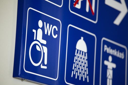 Disabled toilet sign close up