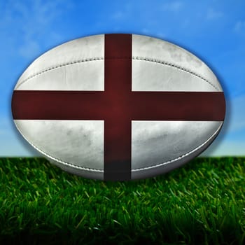 Rugby ball with England flag over grass