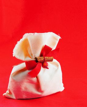 Christmas sack with decoration over red background