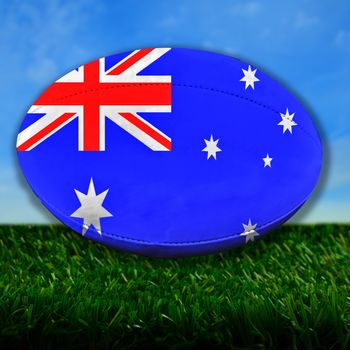 Rugby ball with Australia flag over grass