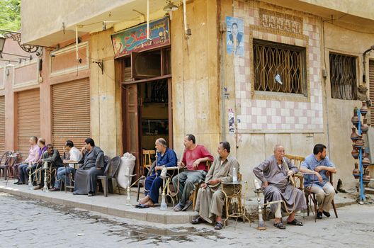 men smoking in cairo old town in egypt