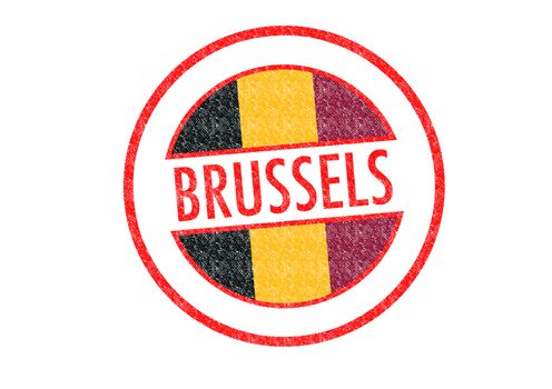 Passport-style BRUSSELS rubber stamp over a white background.