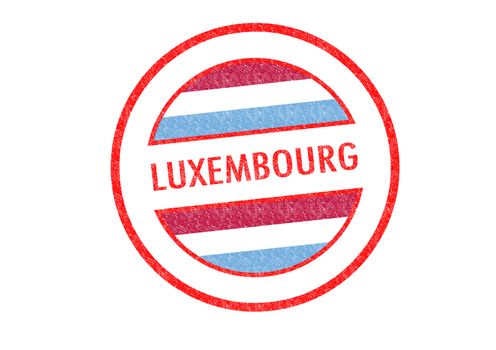 Passport-style LUXEMBOURG rubber stamp over a white background.