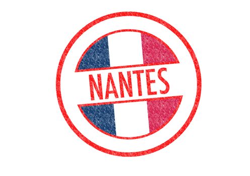 Passport-style NANTES rubber stamp over a white background.