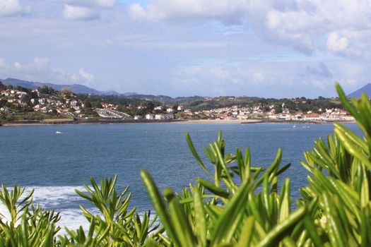 panorama of a coastal town by the sea with its beach and mountains