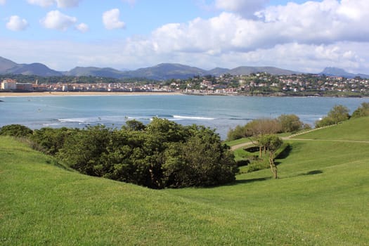 panorama of a coastal town by the sea with its beach and mountains