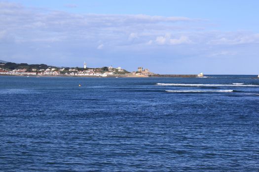 panorama of a coastal town by the sea with its beach and mountains