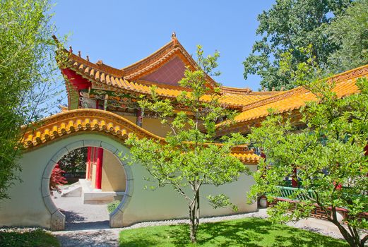 Traditional chinese garden with round gate