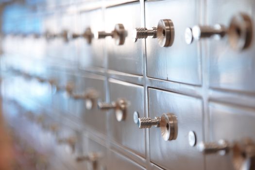 Several safes. Horizontal, closeup view with shallow depth of field