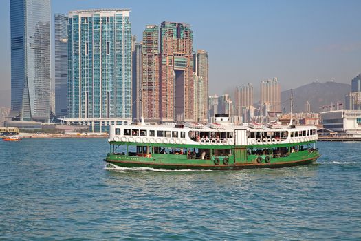 HONG KONG - DECEMBER 3: Ferry "Celestial star" leaving Kowloon pier on December 3, 2010 in Hong Kong, China. Ferry is in operation in Victoria harbor for more than 120 years and is one of tourist attractions.