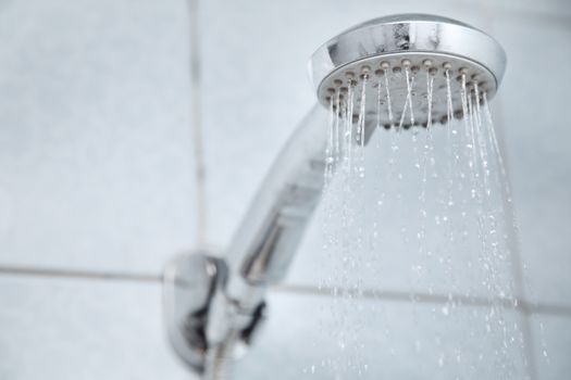 Shower in bathroom with water flowing
