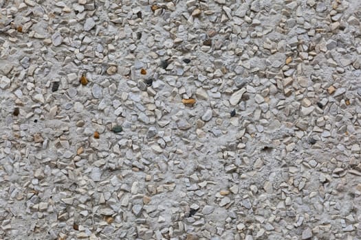 Gray pebble stone tile surface background.