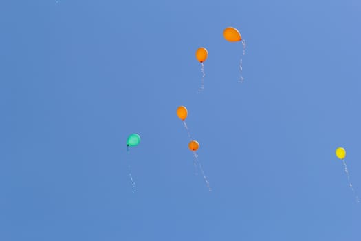 color balloons flying to the sky