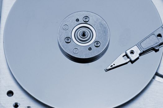 Open computer hard drive on white background with blue (HDD, Winchester)