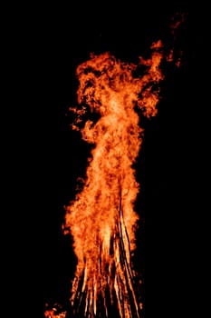 red flames of huge bonfire or campfire as black backgorund