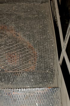 old rusty industrial staircase with yellow fence