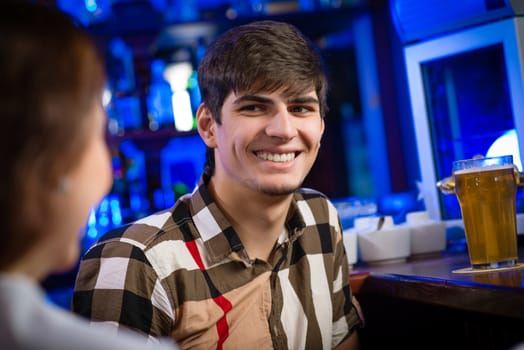 portrait of a young man at the bar, fun nightlife