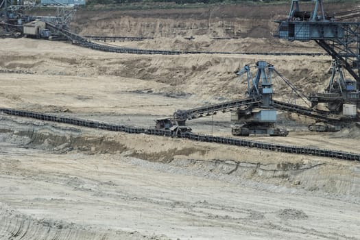 Coal mining in an open pit with huge industrial machine