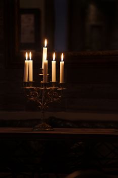 Candles illuminating a dim room