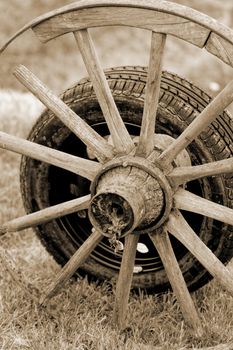 new and old broken wagon (car) wheel