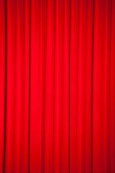 Brightly lit red curtains for background