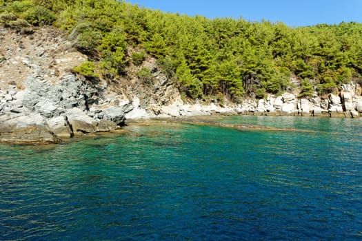 rocky beach with turquoise sea in greece thassos island