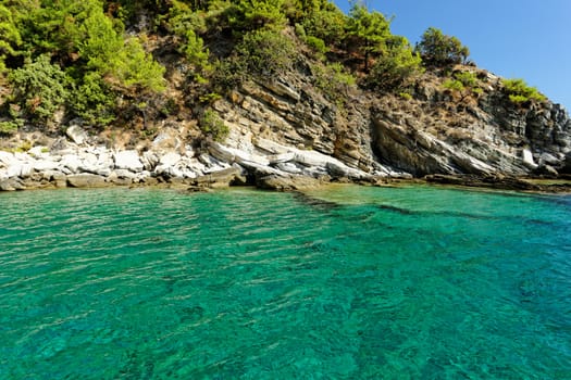 rocky beach with turquoise sea in greece thassos island