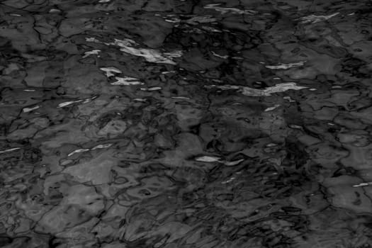 grey abstract background of wavy water surface