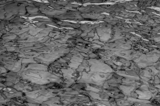 grey abstract background of wavy water surface