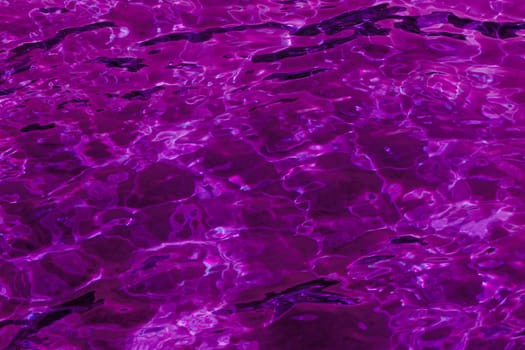 purple abstract background of wavy water surface (lilac)